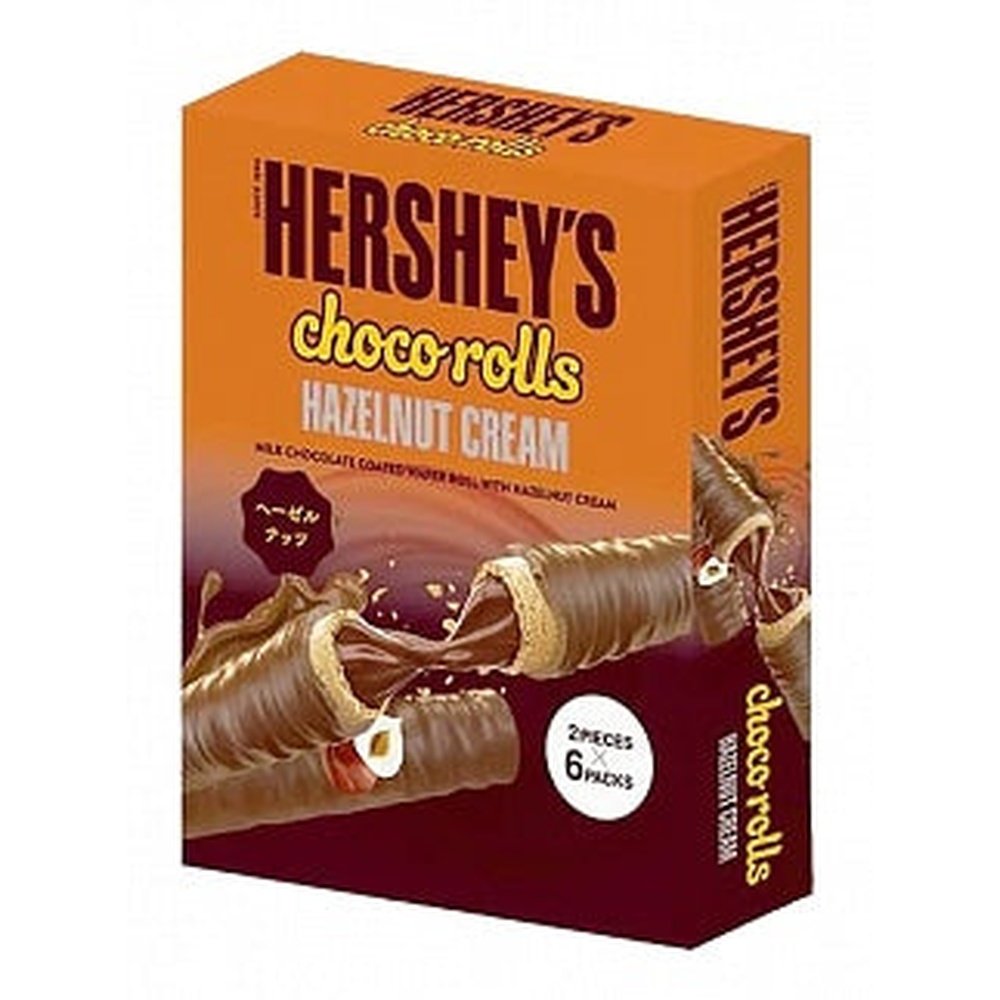 Un carton orange et brun sur fond blanc avec un biscuits au chocolat coupé en 2 avec à l’intérieur du chocolat