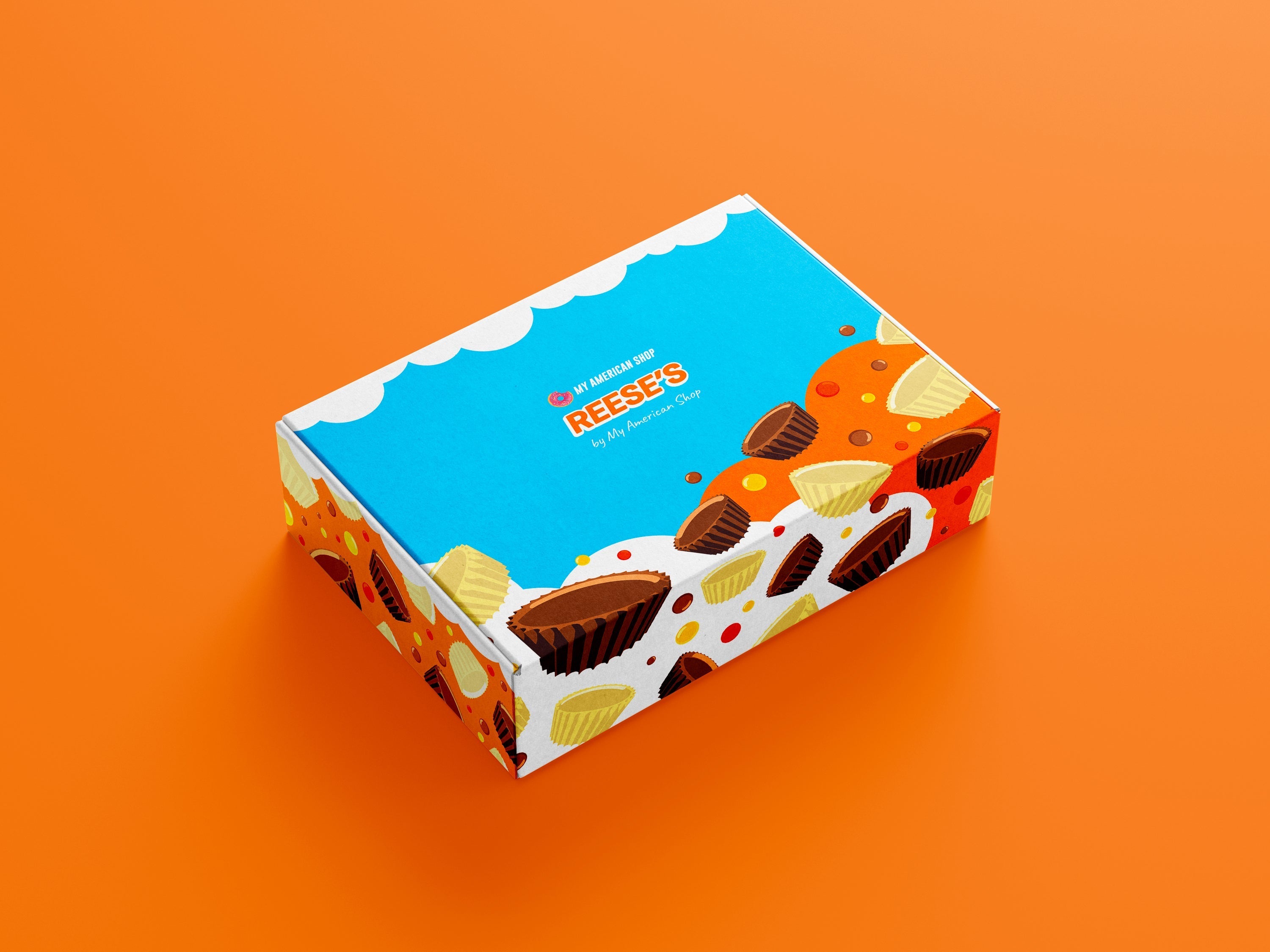 Un carton bleu et blanc avec des dessins de cups Reese’s chocolat au lait et chocolat blanc, le tout sur fond orange
